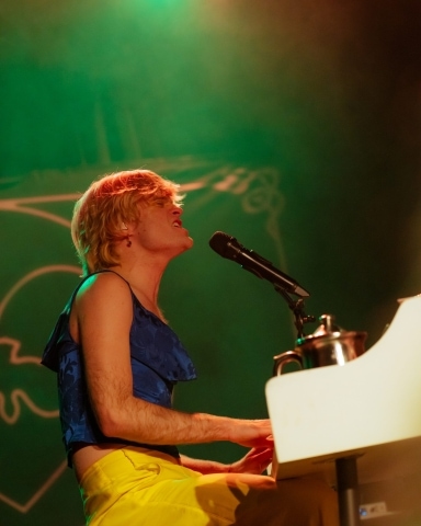 Jake Wesley Rogers performs at  Bimbo's in San Francisco. Medium shot as he plays the piano.