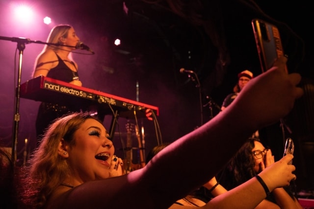 A fan takes a selfie as Stacey Ryan performs at Bimbo's in San Francisco